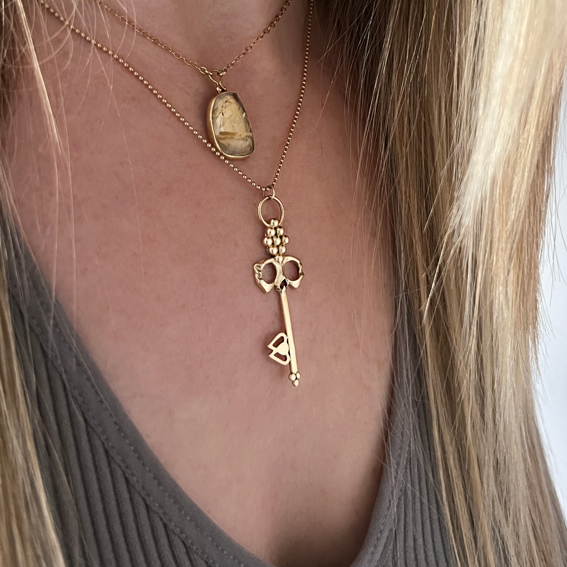 14K gold Skull Key Necklace worn on neck