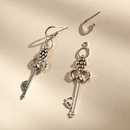 Sterling Silver Skull Key Earrings that dangle from detachable Huggie Hoops that can be worn alone