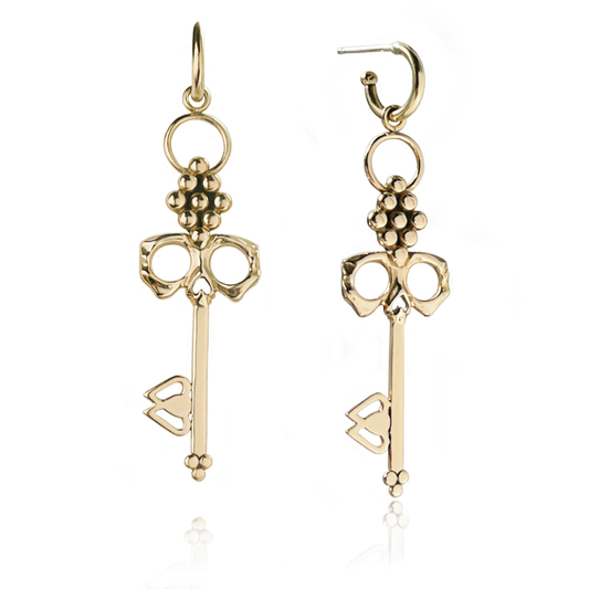 Brass Skull Key Earrings dangle from small detachable Huggie Hoops