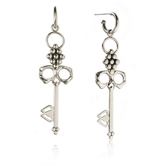 Sterling Silver Skull Key Earrings dangle from Huggie Hoops