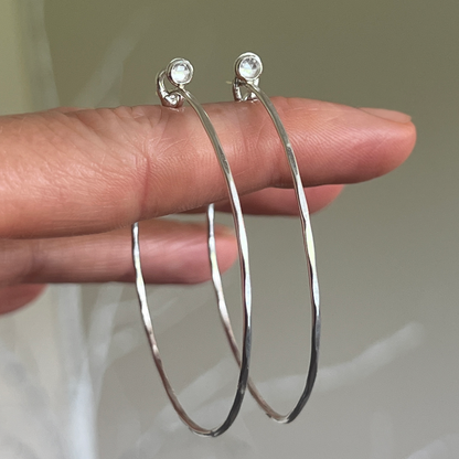Silver hammered Hoops with White Topaz dangled from hand