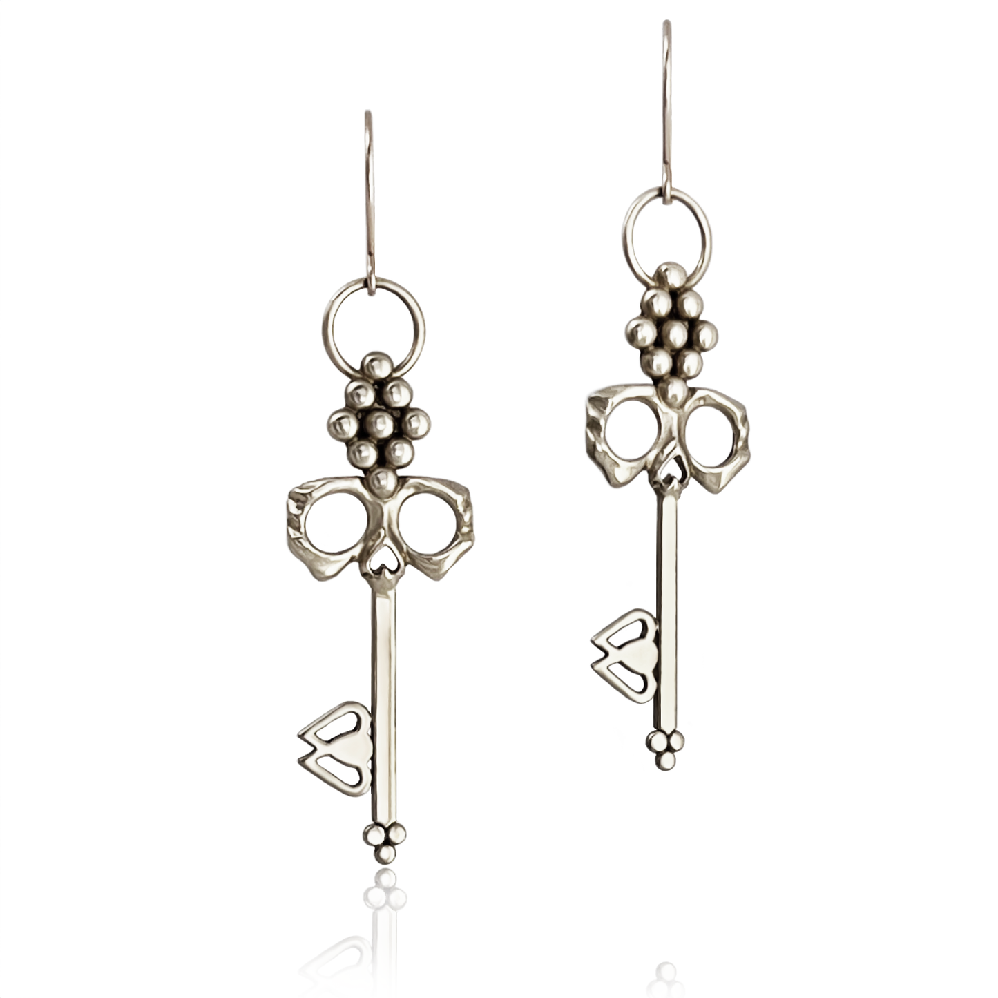 Sterling Silver Skull Key Earrings dangle from handmade French hooks